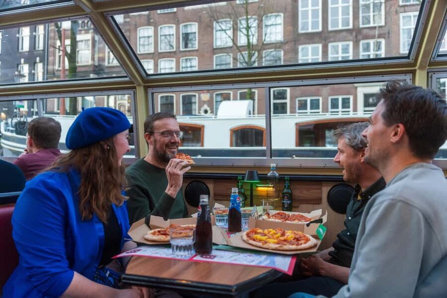 Amsterdam: Original Pizza Dinner Cruise + Unlimited Drinks - NEMO Science Museum and the return to Damrak