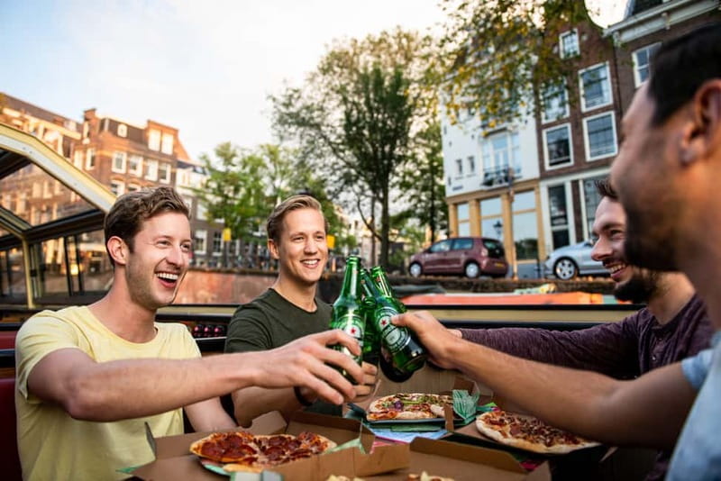 Amsterdam: Original Pizza Dinner Cruise + Unlimited Drinks - A heated boat and a simple dinner setup