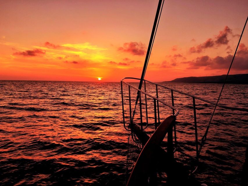 Argostoli: Sunset Cruise with Swim Stops, Dinner, and Wine - Leaving Argostoli harbor in the late afternoon
