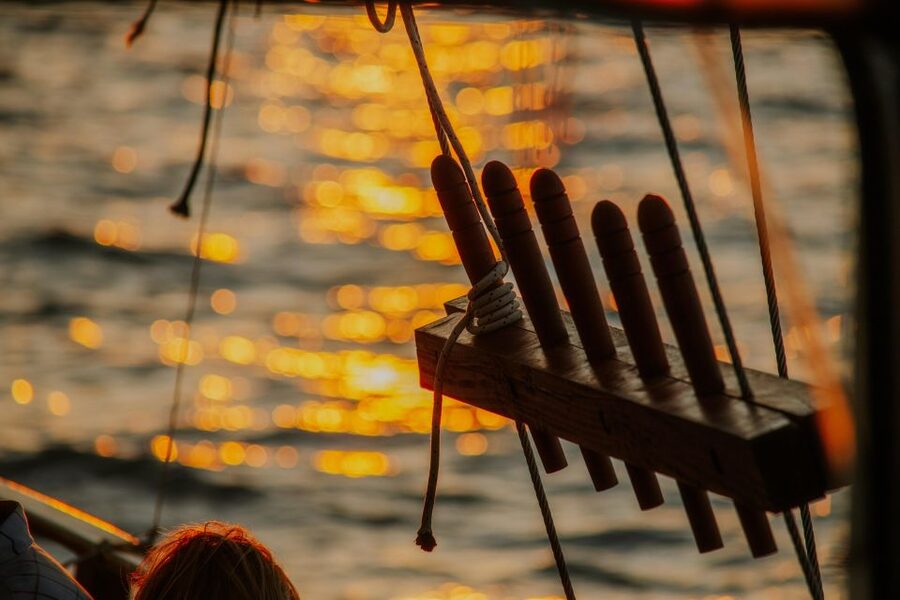 Argostoli: Sunset Cruise with Swim Stops, Dinner, and Wine - Dinner on deck as the light fades