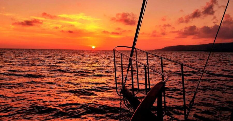 Argostoli: Sunset Cruise with Swim Stops, Dinner, and Wine - What to bring and what to know