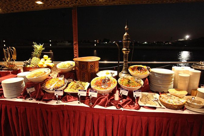 Buffet Dinner Cruise on New Dubai Canal - Boarding a traditional dhow after dark