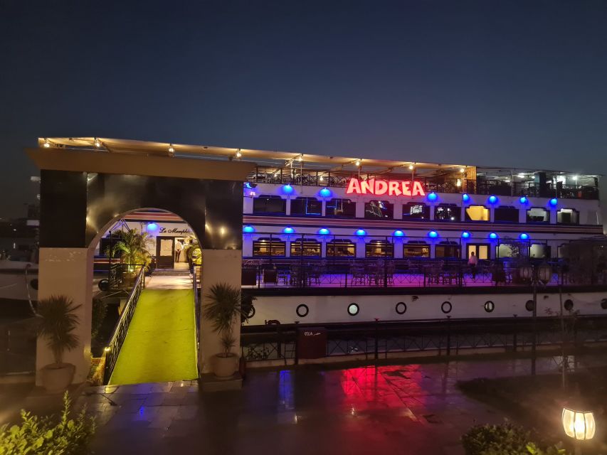 Cairo: Nile Dinner Cruise with Belly Dancer Show and Music - The open-air deck and Cairo after dark