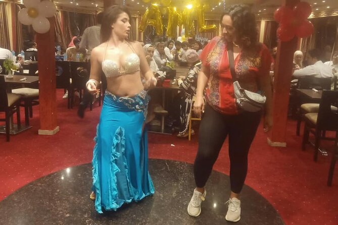 Dinner Nile Cruise belly dancer open buffer tanora show sailing on Nile - Cairo’s Nile at night