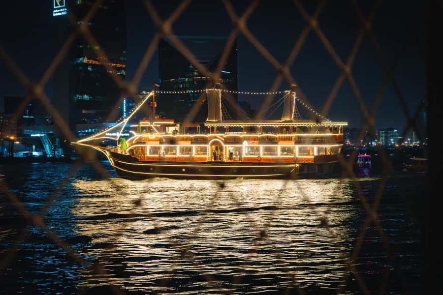 Dubai: Al Seef Largest Dhow Dinner Cruise with Live Show - Watching the Tanoura dance and puppet show