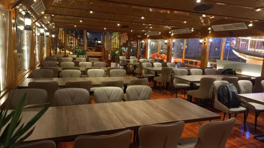 Dubai: Al Seef Largest Dhow Dinner Cruise with Live Show - Eating the barbecue buffet on board