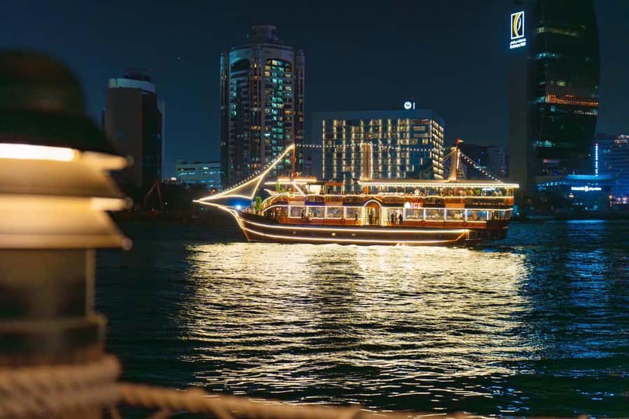 Dubai: Al Seef Largest Dhow Dinner Cruise with Live Show - Boarding a traditional dhow on Dubai Creek