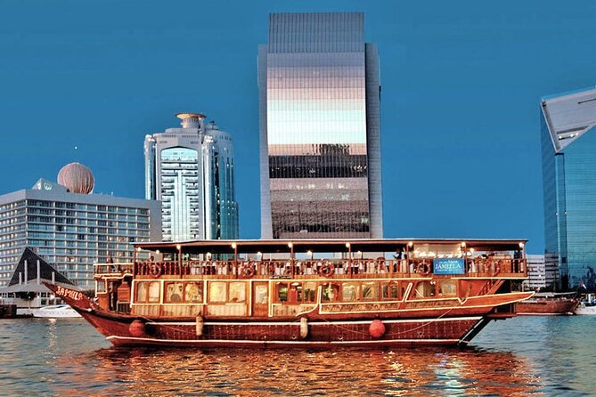 Dubai Creek Cruise Dinner with Transfer - Boarding a carved wooden dhow