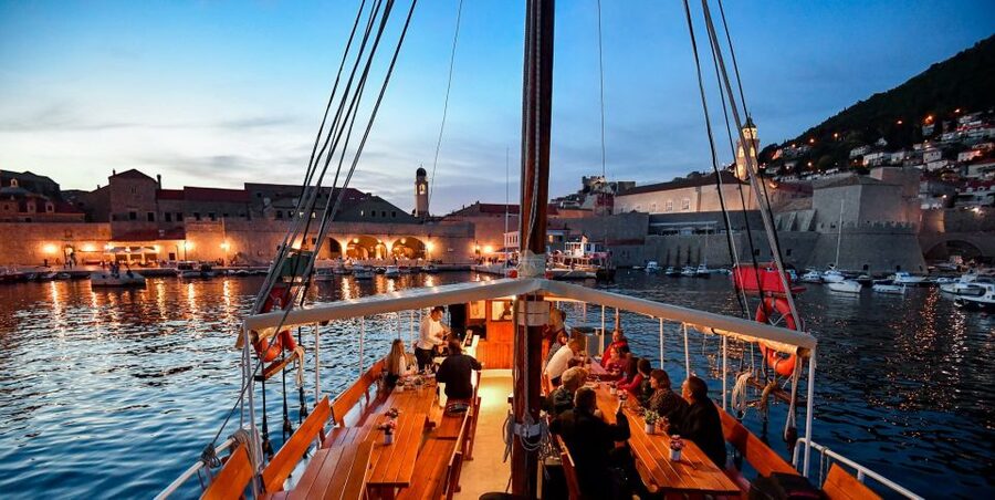 Dubrovnik: Sunset Dinner Cruise around the Old Town - Sunset behind the islands, then the walls by night