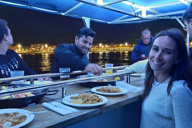 Evening Cruise with Dinner and Drinks in Barcelona - Port Vell, music, paella, and three drinks