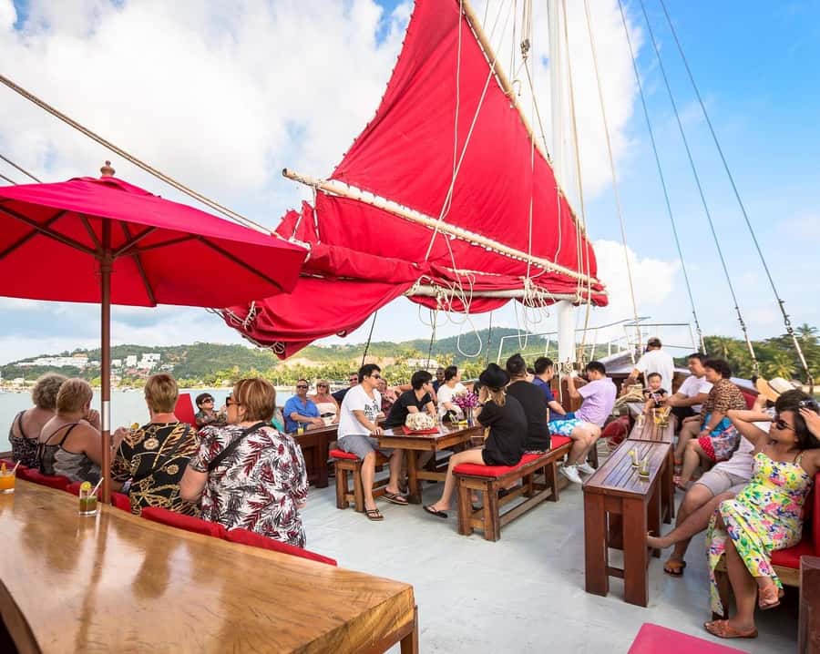 Koh Samui: Red Baron Romantic Sunset Dinner Cruise - Language, hosting, and the pace of the evening