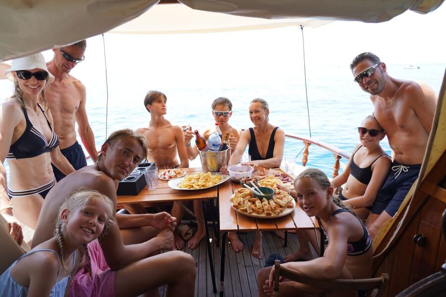 La Spezia: Sunset Cruise with Aperitif and Dinner - Dinner facing illuminated Portovenere
