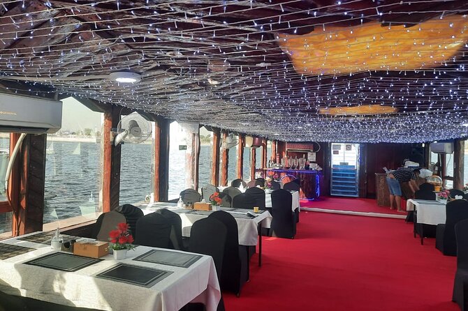 Marina Dhow Cruise with BBQ Dinner and Live shows - Dubai Marina after dark, seen from the water