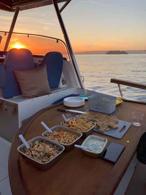 Marseille: Sunset Boat Cruise with Dinner and Drinks - Frioul Islands: two hours for swimming and scenery