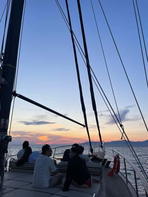 Mykonos: Sunset Boat Cruise with Light Dinner & Drinks - Ornos, Psarou, and Platis Gialos from the sea