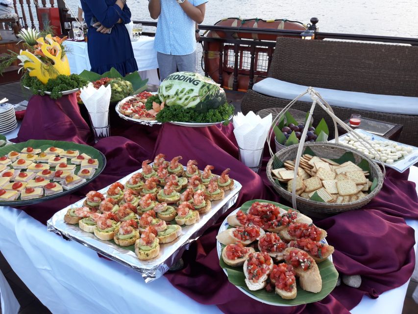 Nha Trang: Romantic Sunset Cocktails and Dinner Cruise - Cocktails, wine, and music on the open deck