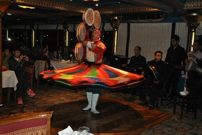 night-tour Nile dinner cruise with open buffet and belly dancer - Arabic and English songs keep the show accessible