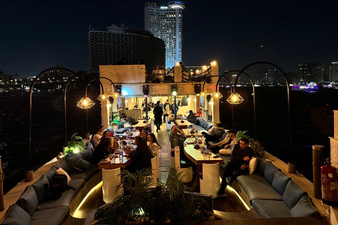Open Air Nile Dinner Cruise with Sunset or Night Vibes - Qasr El Nil Bridge and its bronze lions
