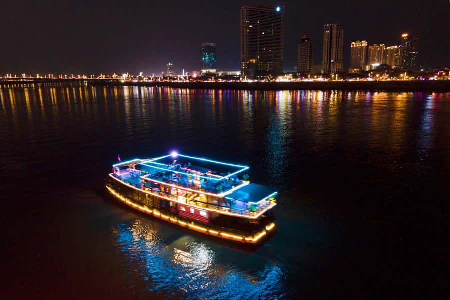 Phnom Penh: Sunset Dinner Cruise with English Speaking Guide - Royal Palace and Hotel Cambodiana from the water