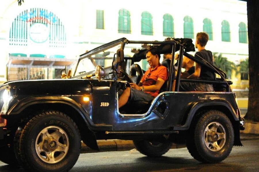 Private Jeep Tour Saigon by Night & Cruise Dinner with Music - From city streets to the dinner boat