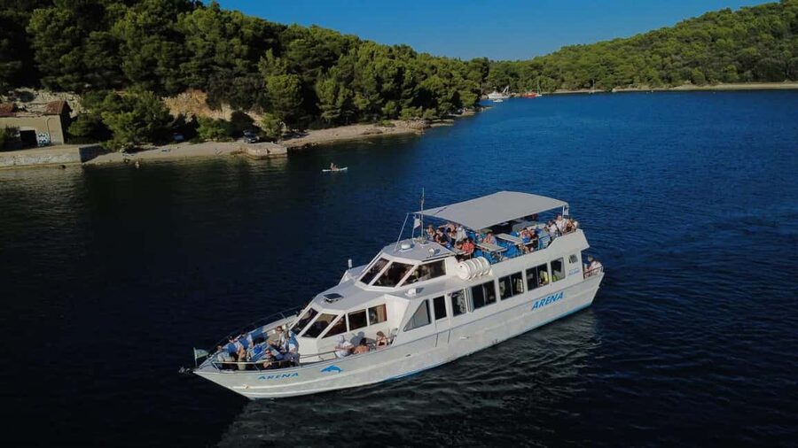 Pula: Brijuni Dolphins Sunset Cruise with Dinner and Drinks - Leaving Pula as the evening light softens