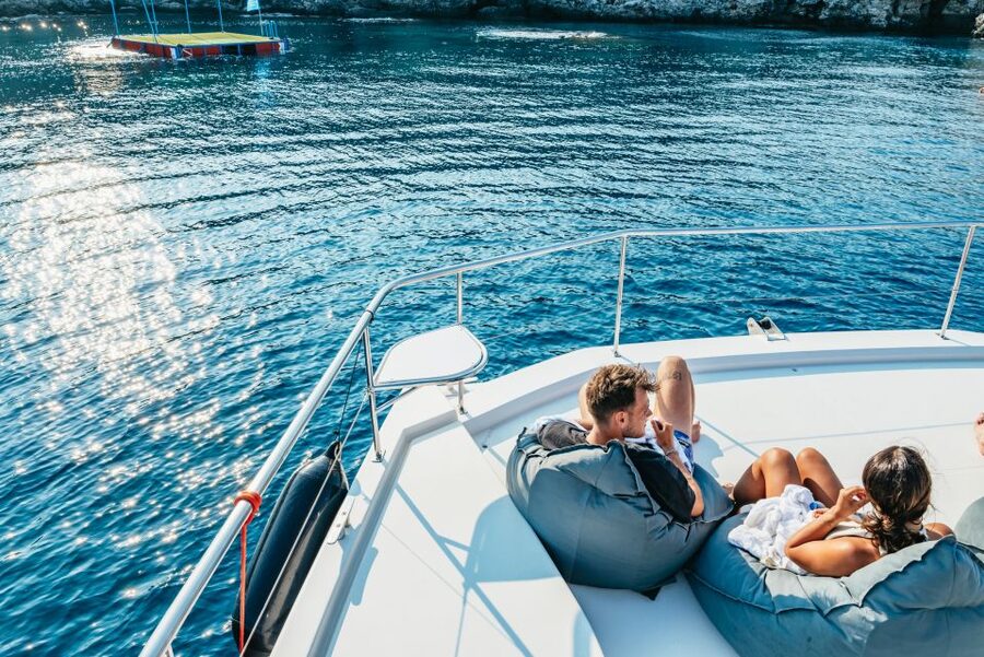 Rhodes: Sunset Catamaran Cruise with Dinner Buffet & Drinks - Leaving Mandraki Harbor in the Late Afternoon