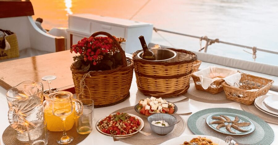 Rhodes: Sunset Cruise with Open Bar, Dinner, & Live Music - Sunset views, city lights, and live music