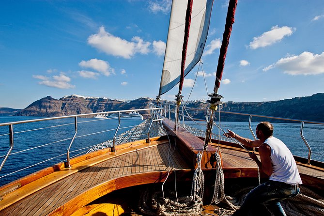 Santorini Caldera Sunset Sailing Cruise with Dinner and Wine - Thirassia Bay dinner: a Greek buffet with a social mood