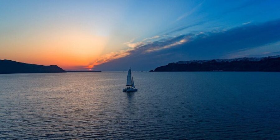 Santorini: Private Sunset Cruise with Dinner and Drinks - Swimming near the volcanic islands and hot springs