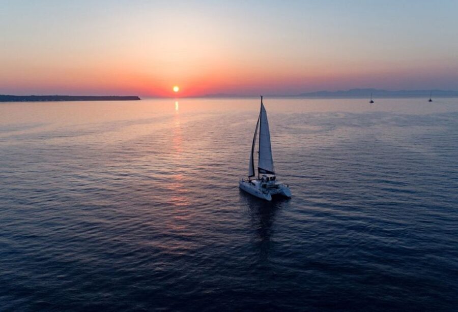 Santorini: Private Sunset Cruise with Dinner and Drinks - Thirassia and the shape of the caldera