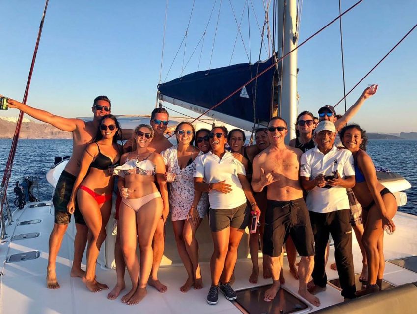 Santorini: Sunset Cruise with Greek Dinner and Transfer - The Santorini sunset from the Aegean