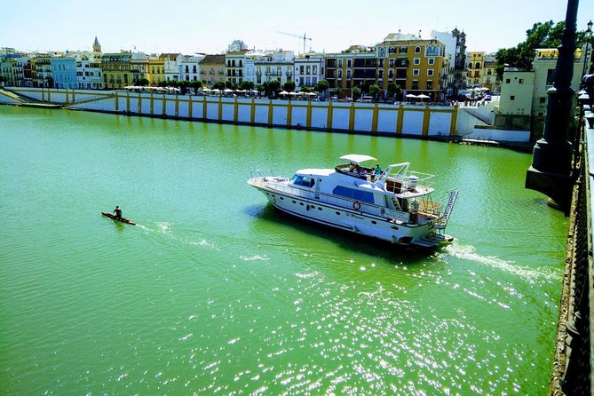 Seville: Guadalquivir River Cruise with Lunch or Dinner - A restaurant boat with a view of Seville