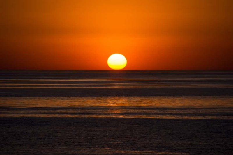 Sunny Beach: Sunset Catamaran Cruise with Dinner & Prosecco - The return across the bay after dark